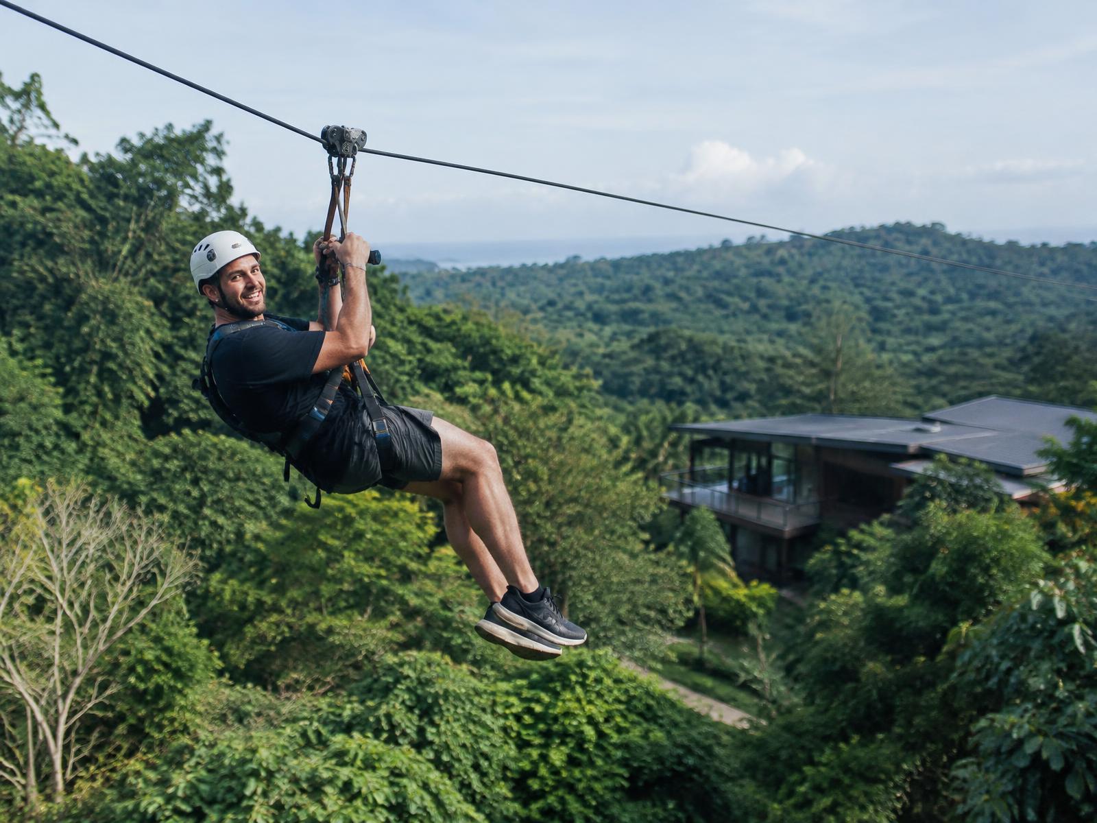 Guest riding the 400-metre zipline at the Pale Blue property on the Gold Coast